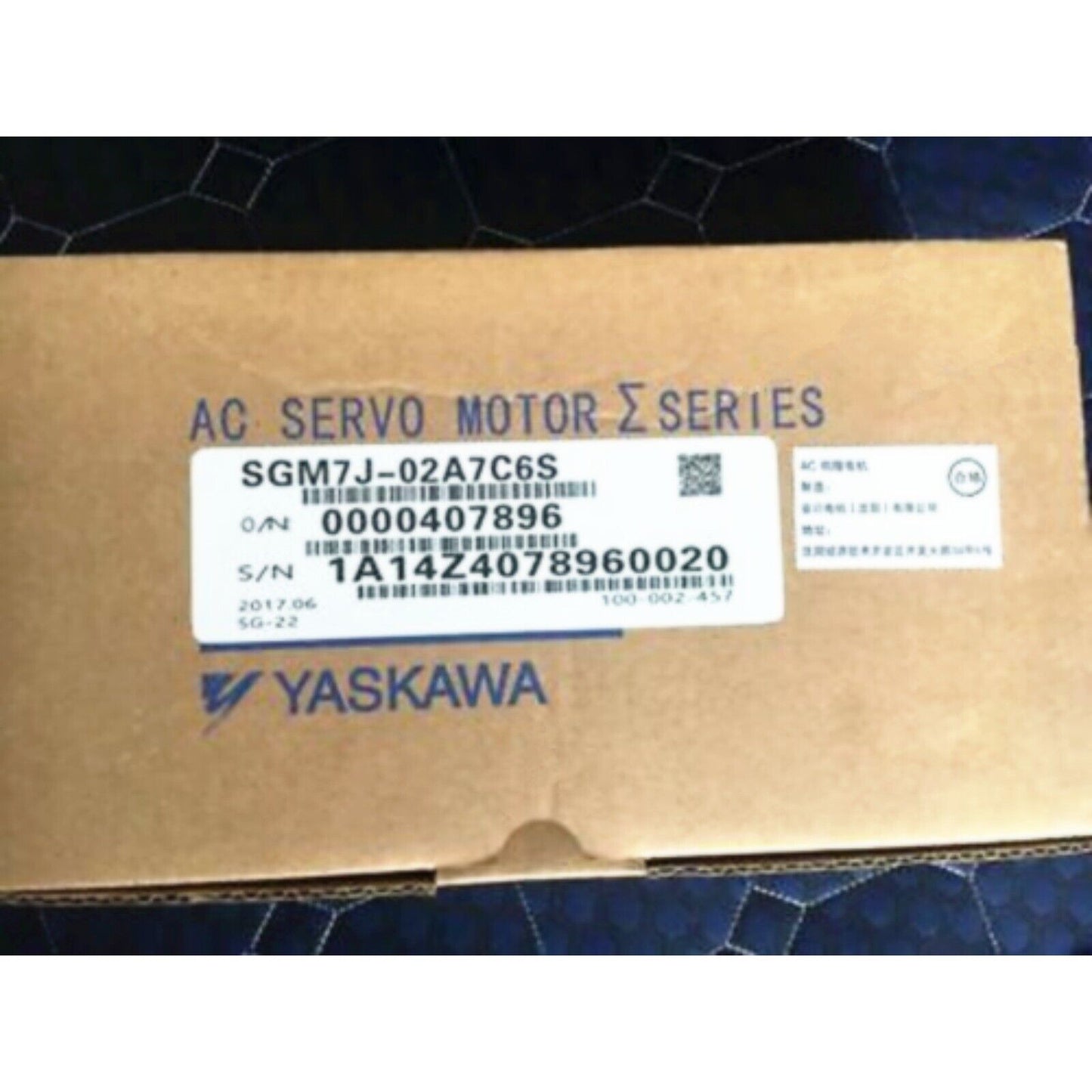 YASKAWA SGM7J-02A7C6S Servo Motor box, product label visible, industrial automation component.
