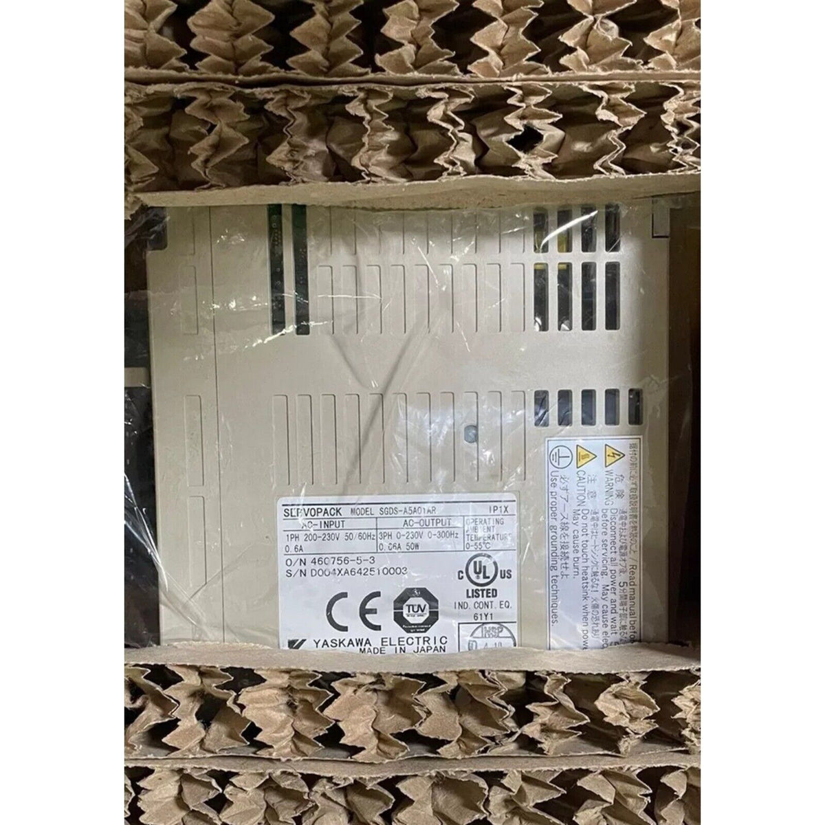 Yaskawa SGDS-A5A01AR SERVOPACK servo drive in box, industrial automation part, product label detail.