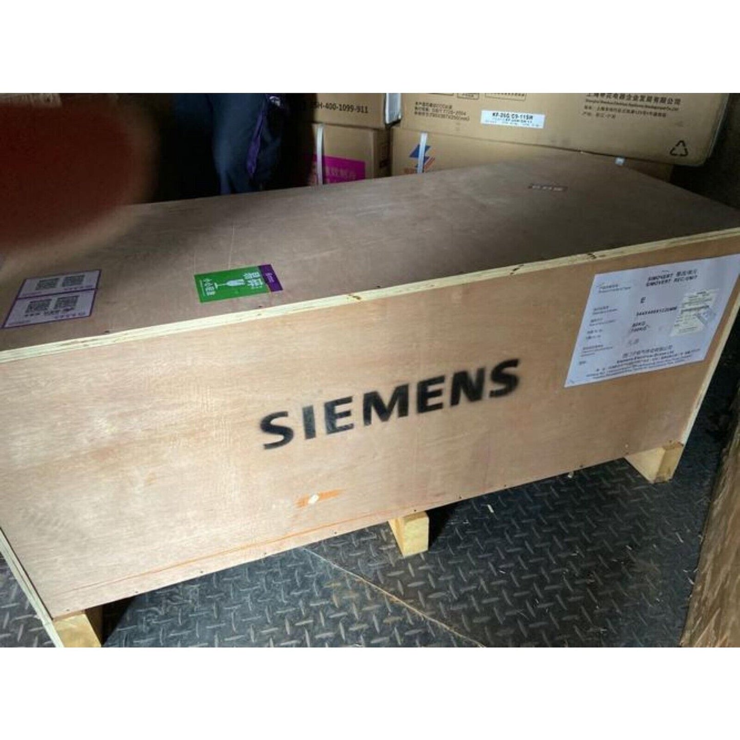 Siemens industrial equipment wooden crate, large box with product label, on metal surface