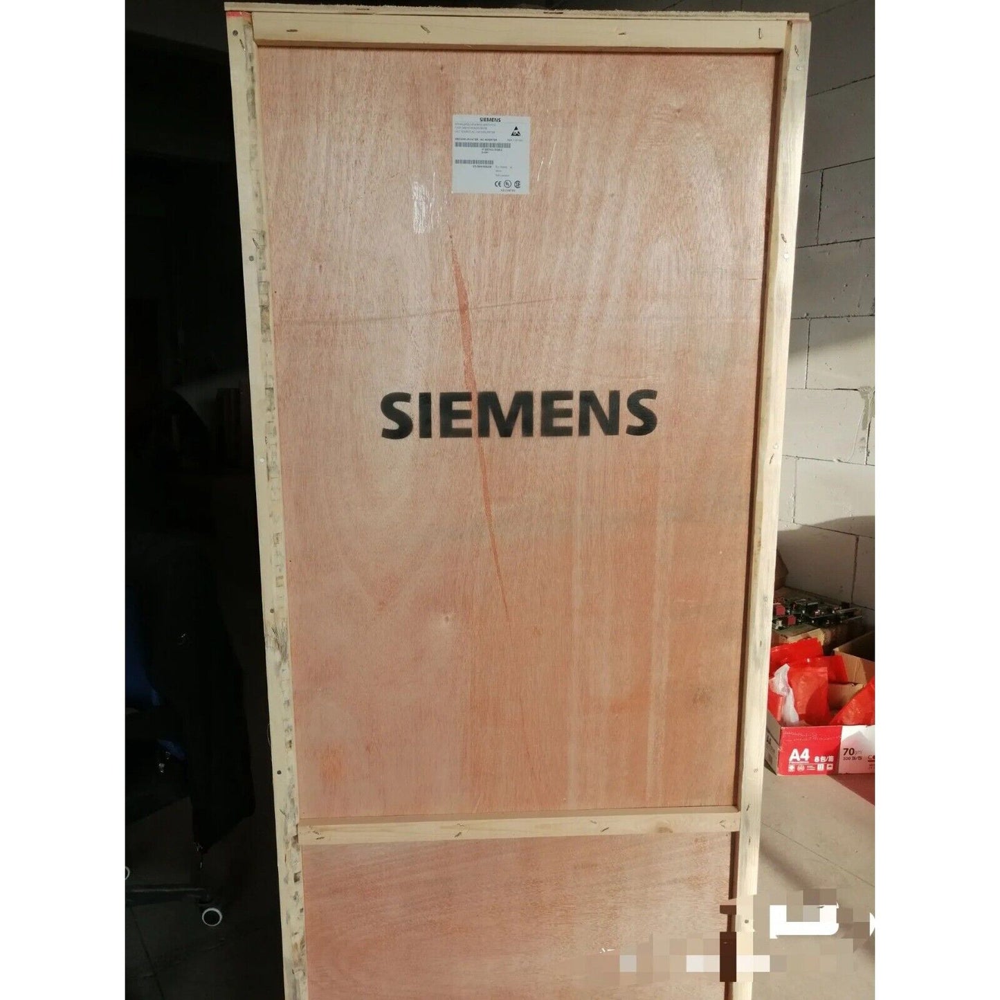 Siemens PLC replacement power block in wooden shipping crate, industrial automation parts.