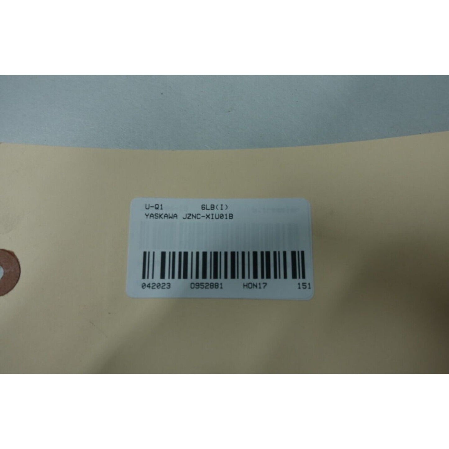 Yaskawa JZNC-XIU01B product label showing model information and barcode, relevant to industrial automation.