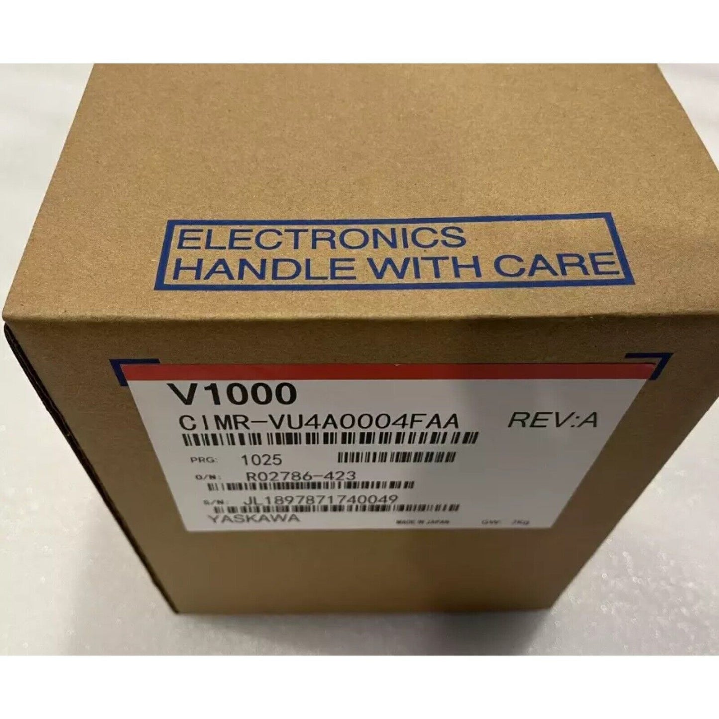 YASKAWA V1000 CIMR-VU4A0004FAA inverter in box. 'Electronics Handle with Care' label. Industrial automation part.