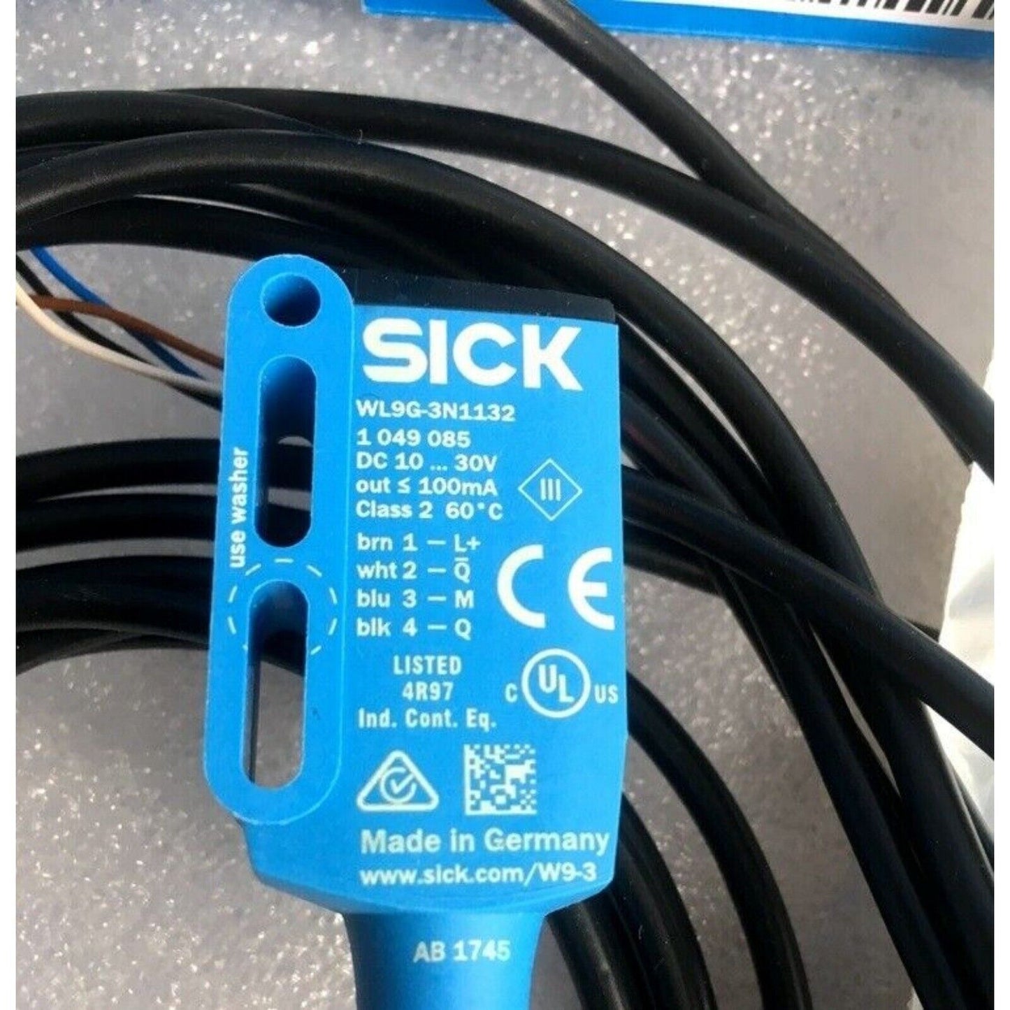 SICK WL9G-3N1132 Photoelectric Sensor with black cable. Industrial automation component, Made in Germany.