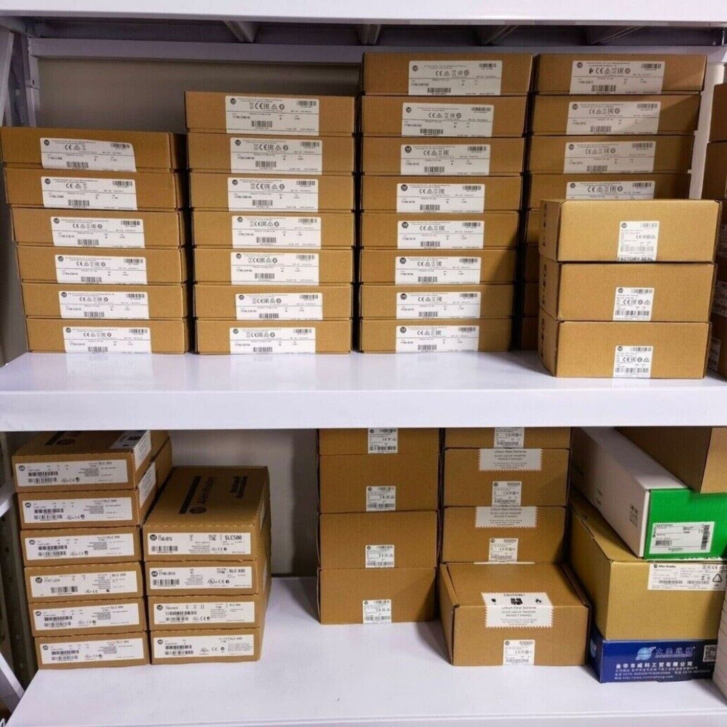 Industrial automation parts, Allen-Bradley parts in boxes on shelves.