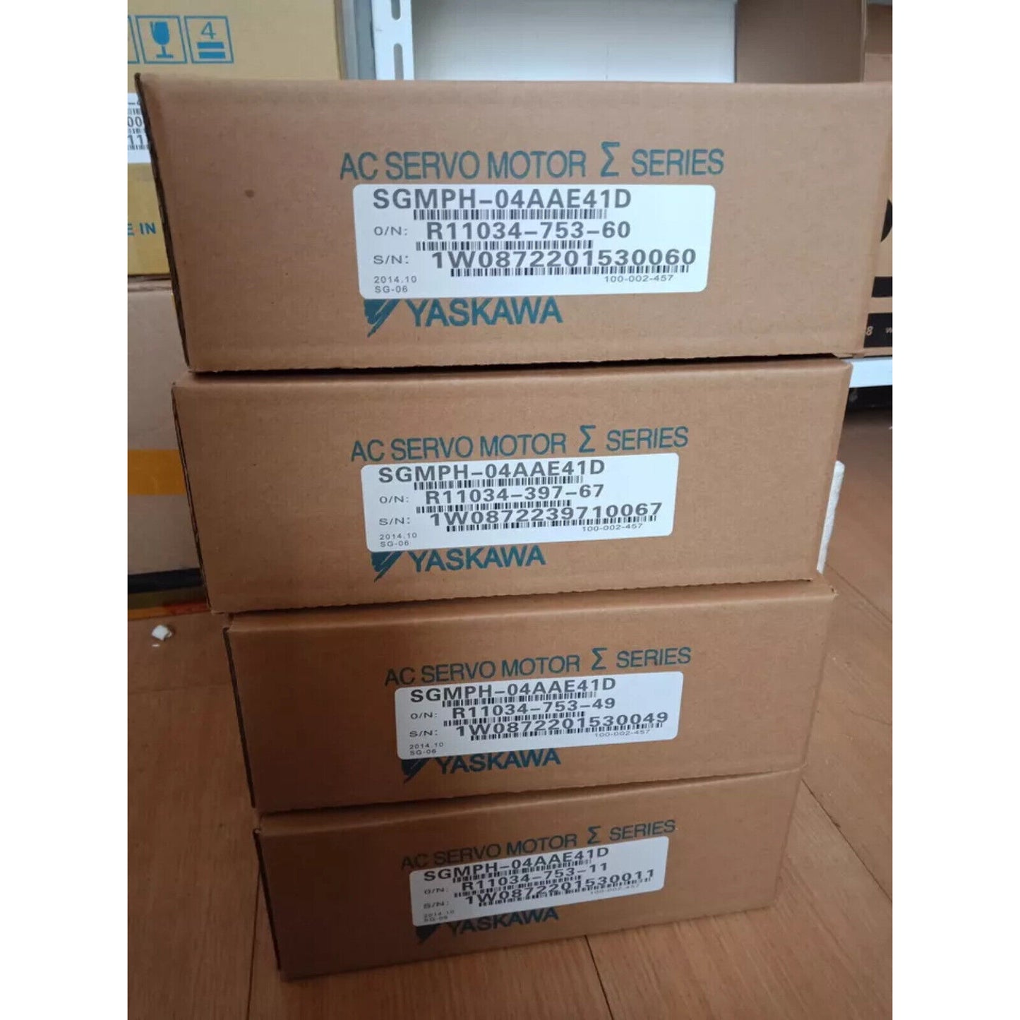 YASKAWA SGMPH-04AAE41D AC Servo Motors in boxes, industrial automation parts.