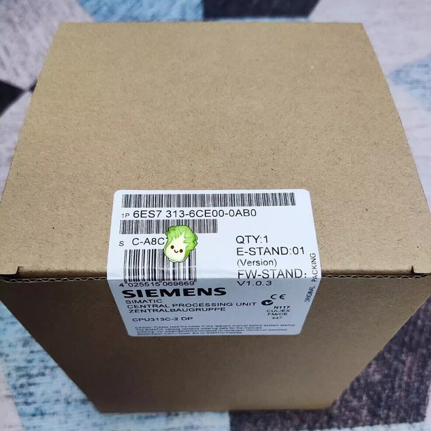 SIMATIC S7-300 CPU 313C-2 DP PLC module by Siemens. Part number 6ES7 313-6CE00-0AB0. Industrial automation part in its box.