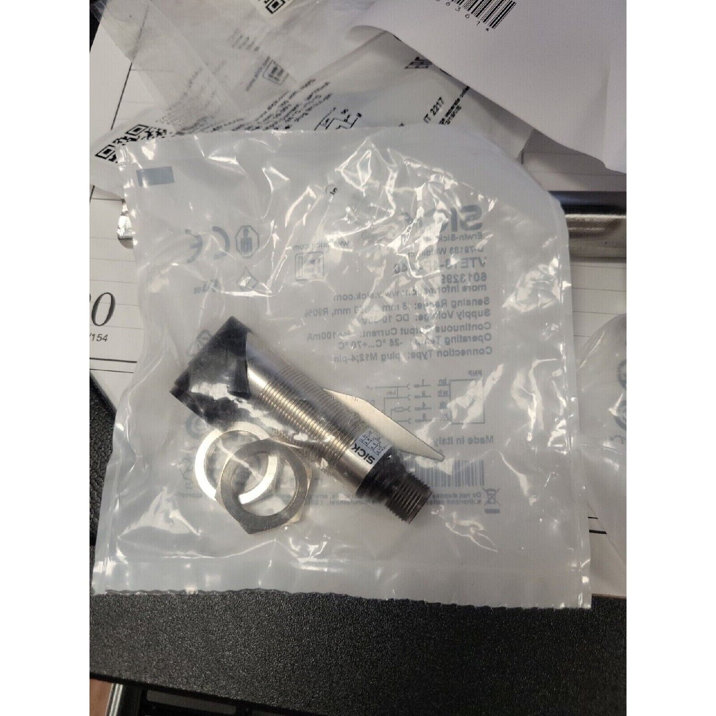 New SICK VTE18-4P4440 Photoelectric Sensor in packaging. Industrial automation part, brass body, black sensor head.