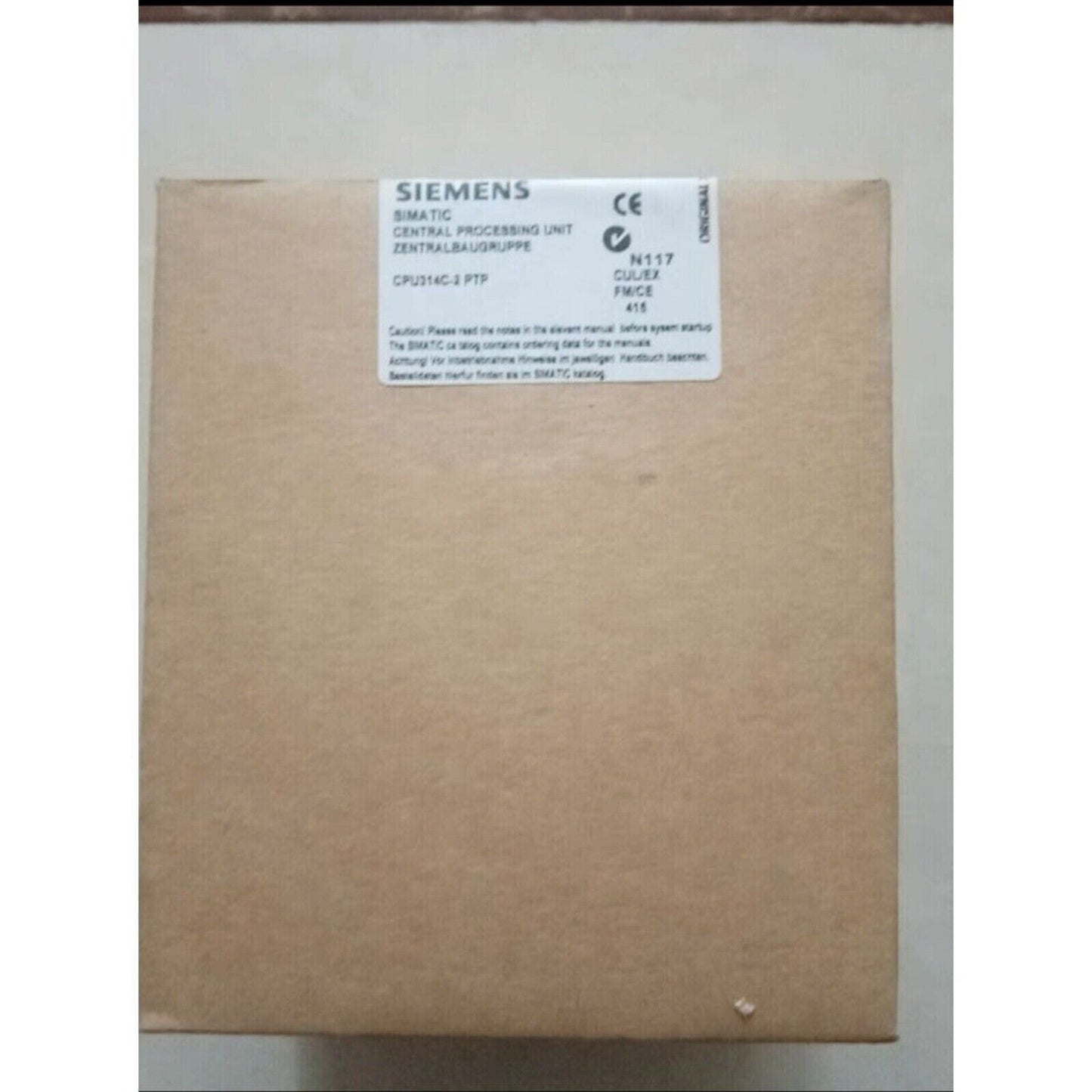 Siemens SIMATIC S7-300 CPU 314C-2 PTP in packaging, brown cardboard box, industrial automation part.
