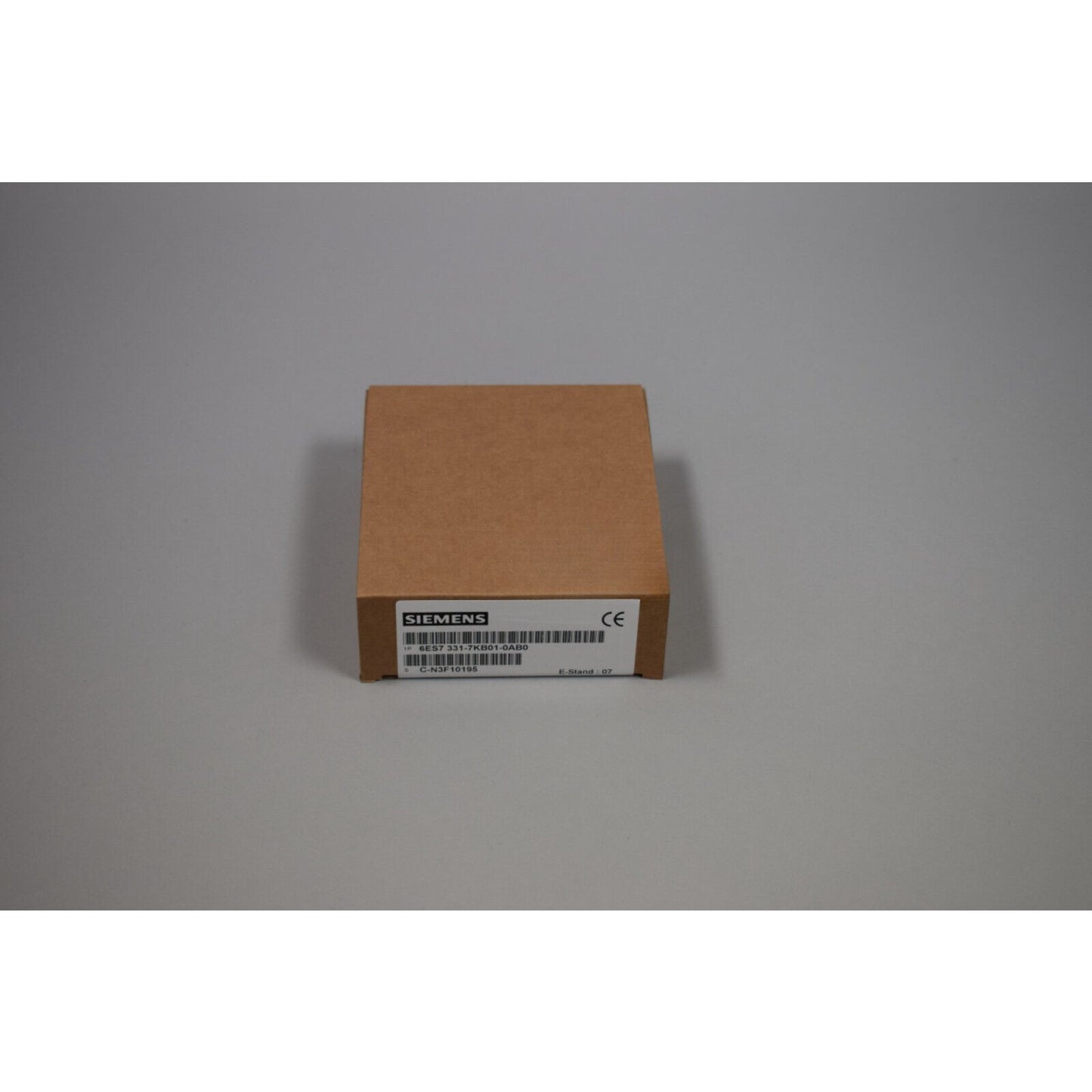 Siemens 6ES7 331-7KB01-0AB0 S7-300 Analog Input Module in a brown box.