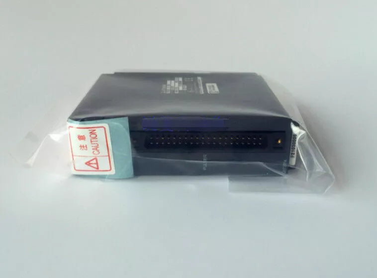 New Mitsubishi Q173PX CPU Module, Industrial PLC automation part in original packaging, Caution label.