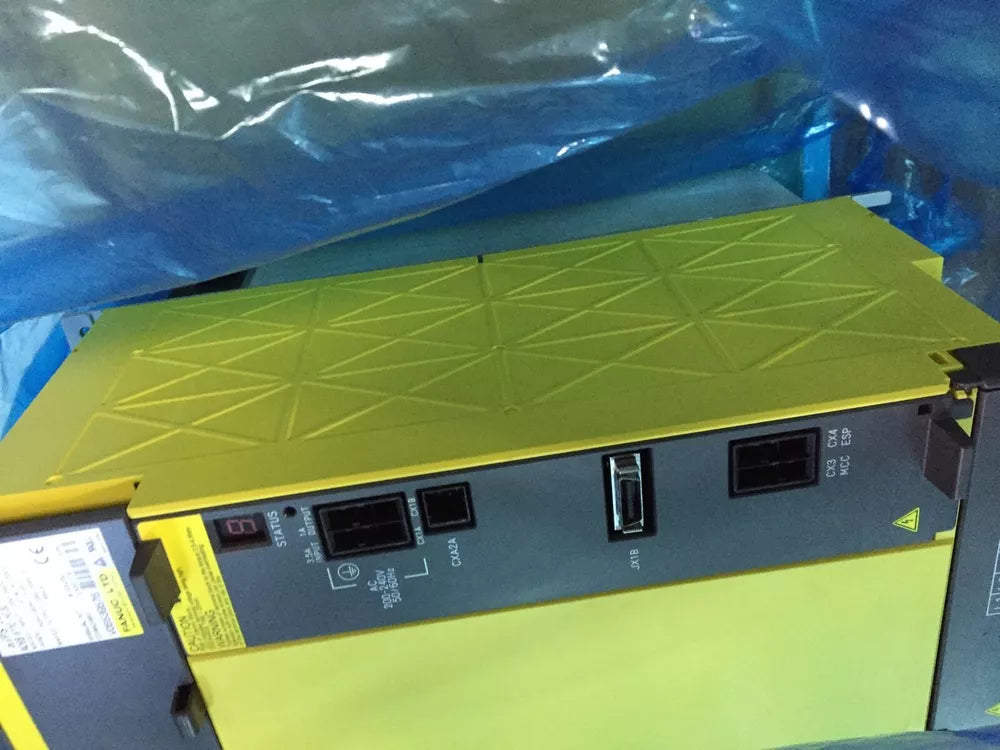 FANUC A06B-6110-H030 Servo Amplifier - Yellow and Gray Industrial Equipment, with Status Display and Input/Output details.