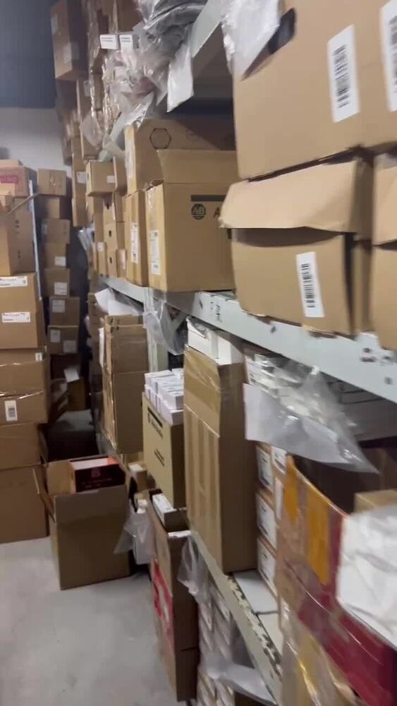 Warehouse stock of industrial automation parts, including FANUC servo drives, ready for fast shipping.
