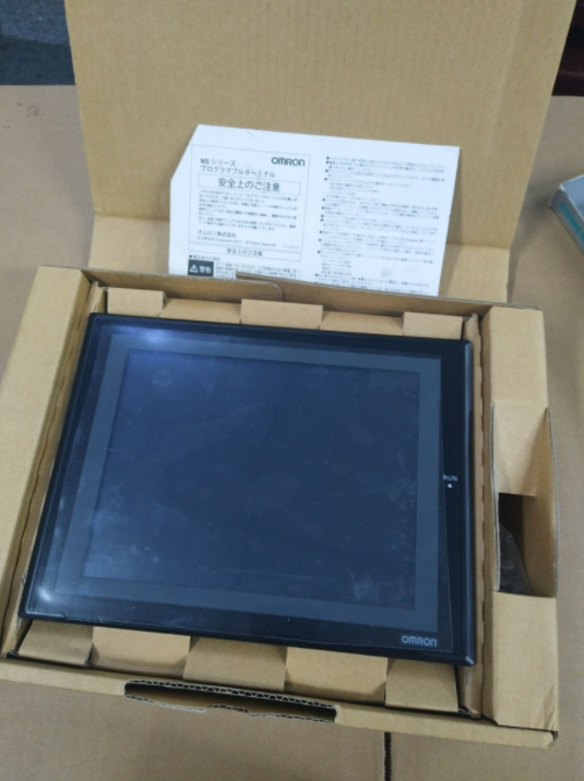 OMRON NS8-TV00B-ECV2 HMI touch screen in box with Japanese safety instructions, Industrial automation part.