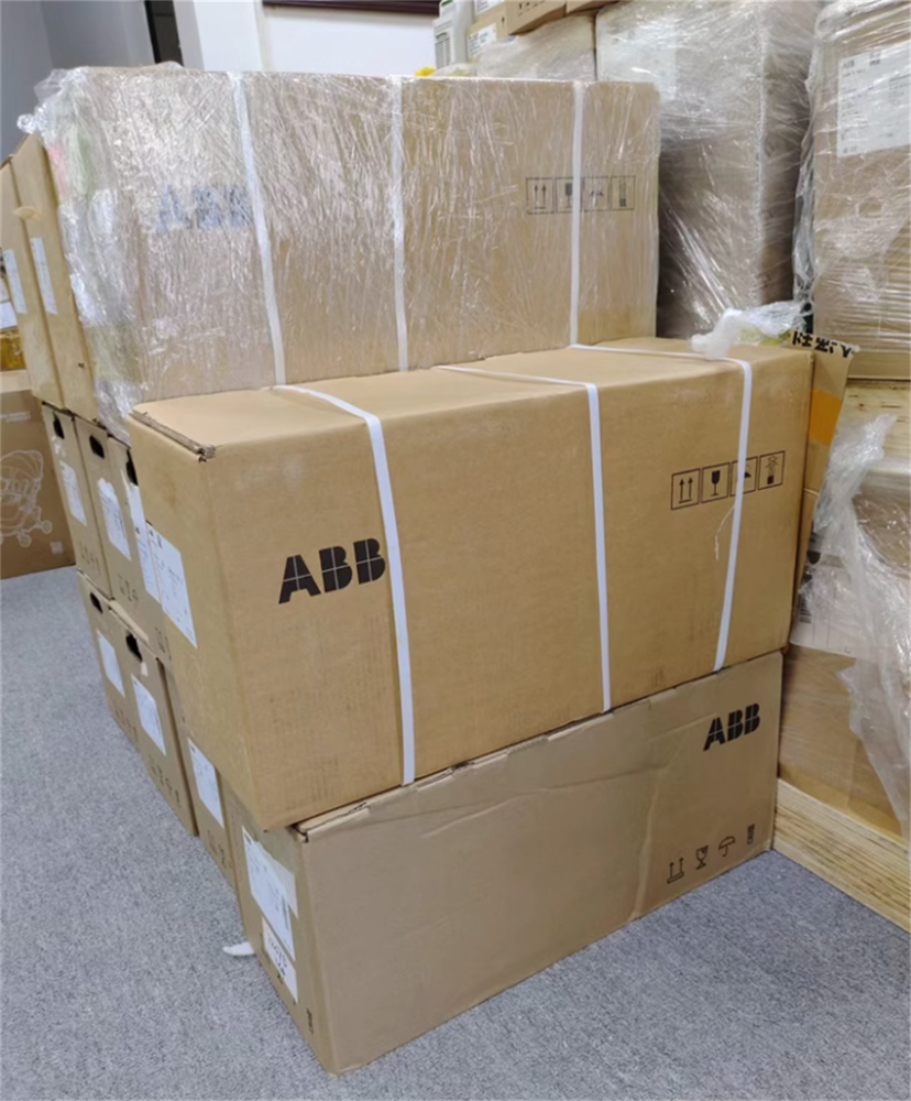 Stacked ABB ACS880-01-038A-3 inverter boxes, ready for shipment, brand logo visible on cardboard packaging.
