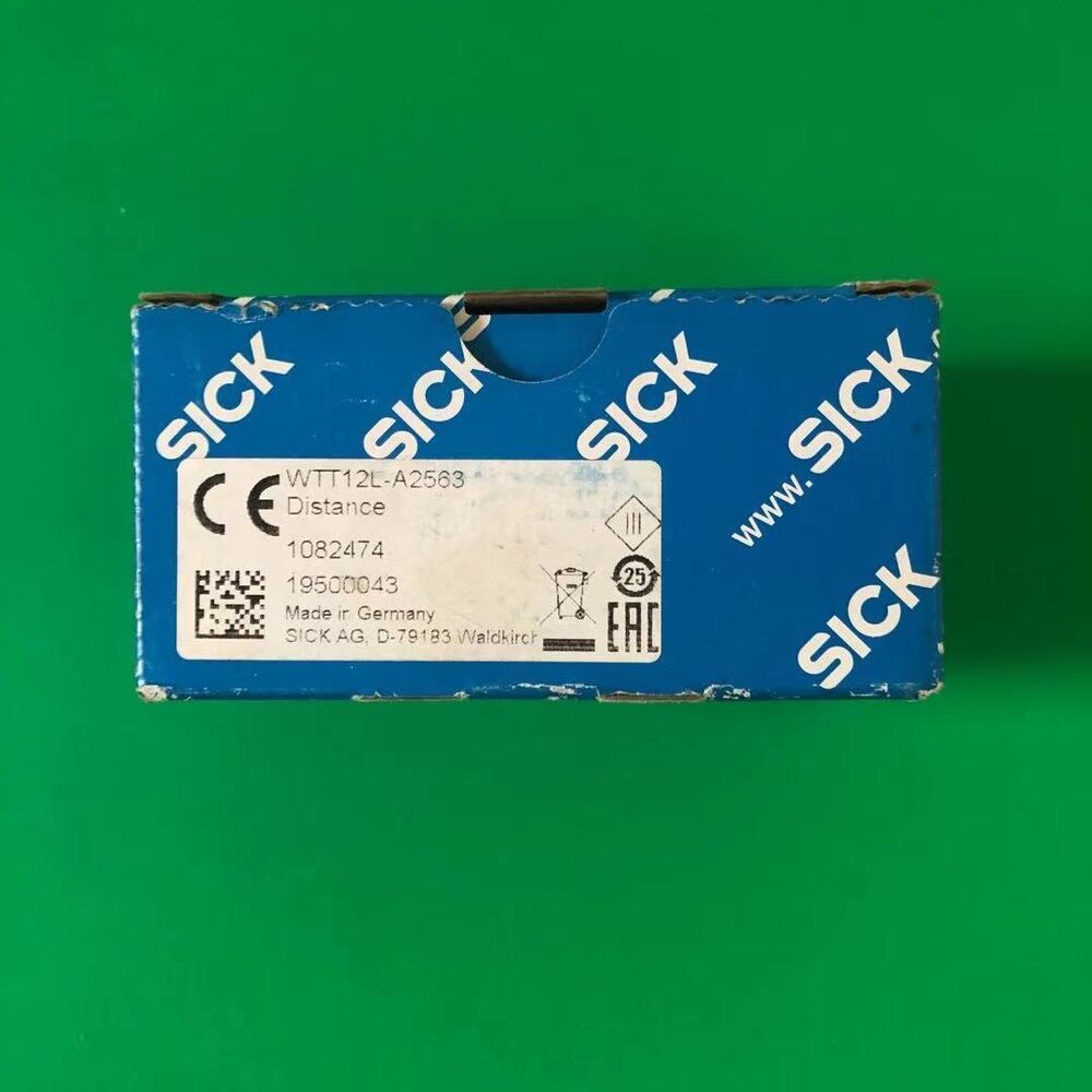 SICK WTT12L-A2563 Photoelectric Sensor product shot, showing packaging with product details and brand.