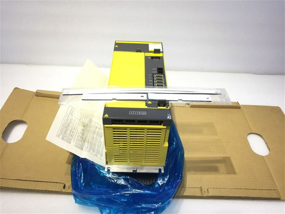 FANUC A06B-6150-H045 Servo Drive, yellow unit in box with documentation, industrial automation part.