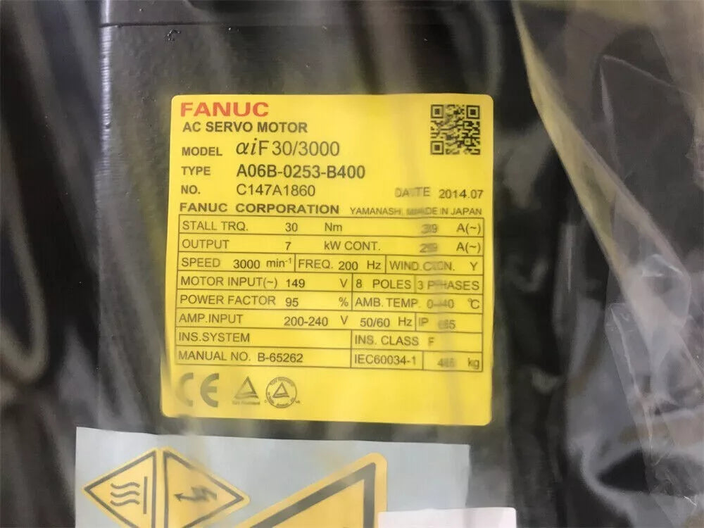 FANUC A06B-0253-B400 servo motor label with specifications and date, industrial automation part