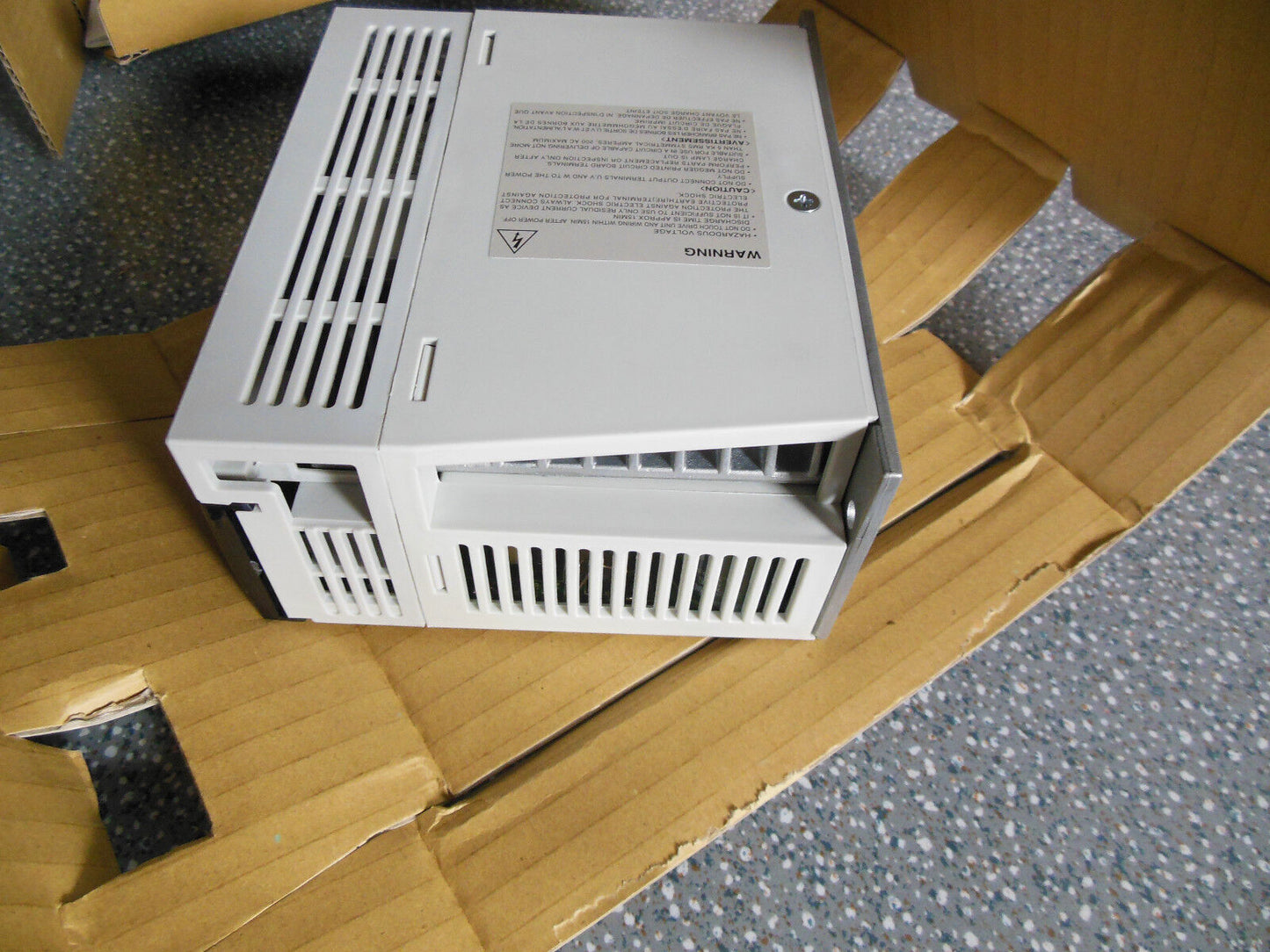 Mitsubishi MR-J2S-60A servo drive in box. Industrial automation part, white with warning label