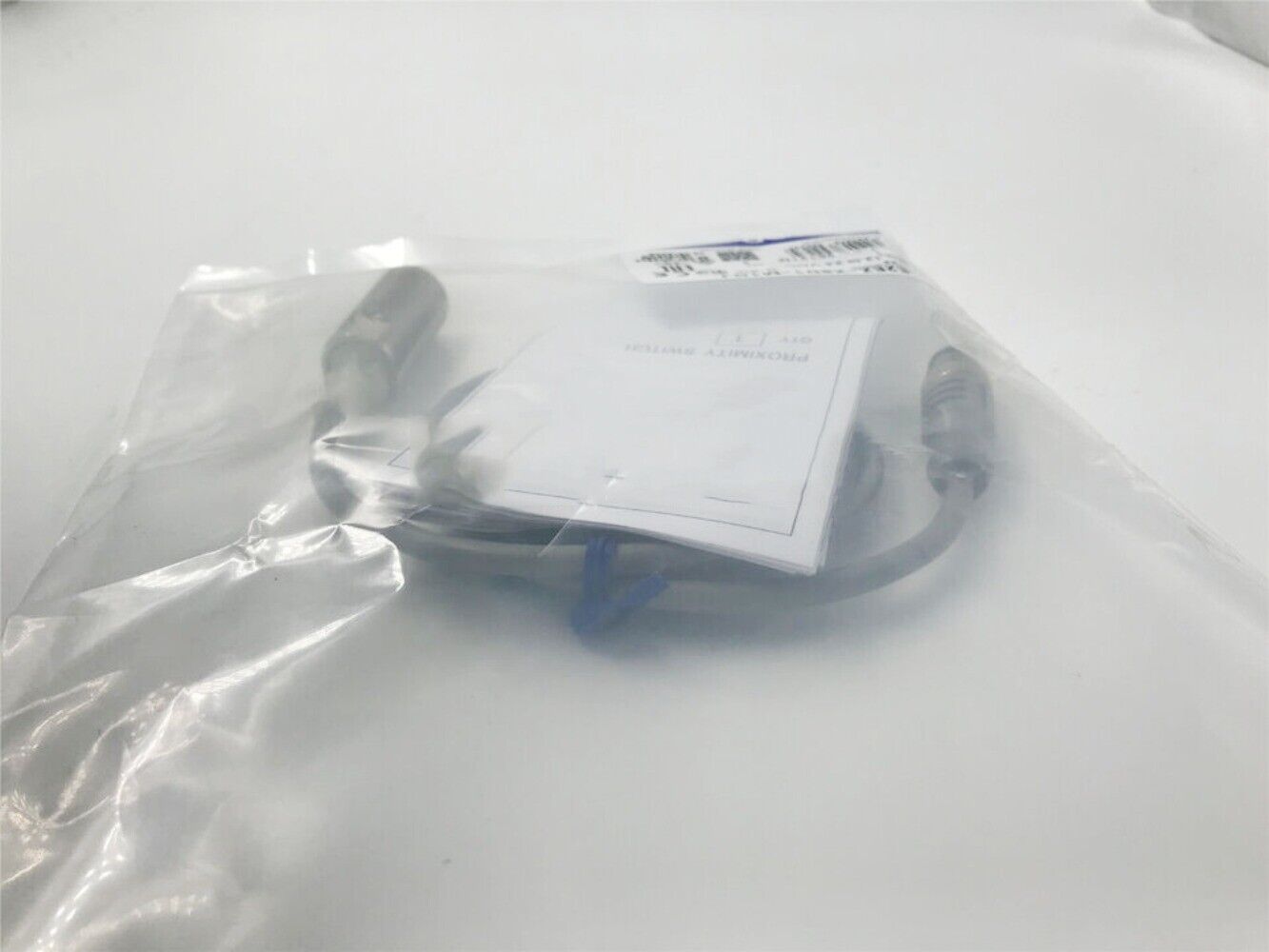 Omron E2EZ-X8D1-M1GJ Proximity Switch in packaging. New 12-24VDC sensor.