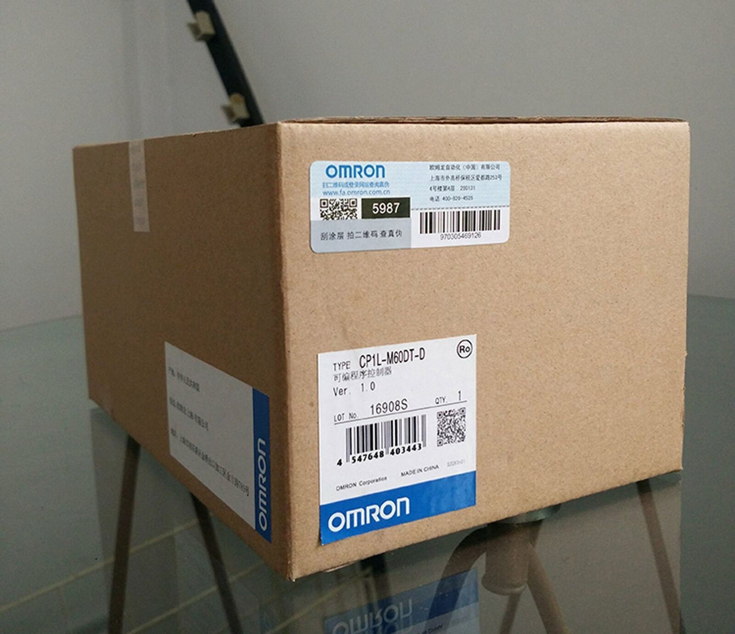Omron CP1L-M60DT-D PLC Module box, new, brown cardboard packaging with labels, Made in China, fast shipping