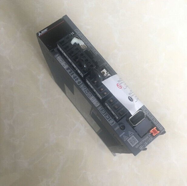 Mitsubishi MR-J4-10A Servo Driver Unit. Industrial automation part with multiple connector ports.