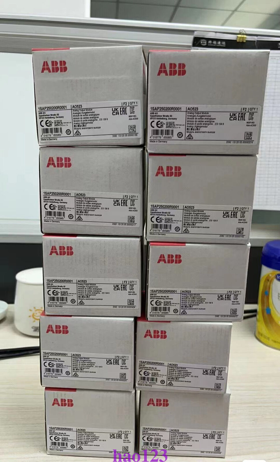 Stacked boxes of ABB AO523 1SAP250200R0001 Analog Output Modules. New PLC modules from ABB.