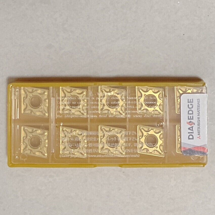 Mitsubishi CNMG120408-MA US735 carbide inserts in yellow case. DIA EDGE label.