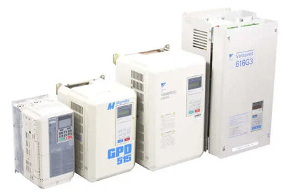 Industrial inverters from Yaskawa, Magnetek GPD 515, and Varispeed 616G3, beige, industrial automation equipment.