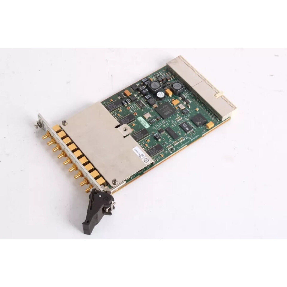 National Instruments PXI-4472 data acquisition module. Industrial hardware with gold connectors and integrated components.