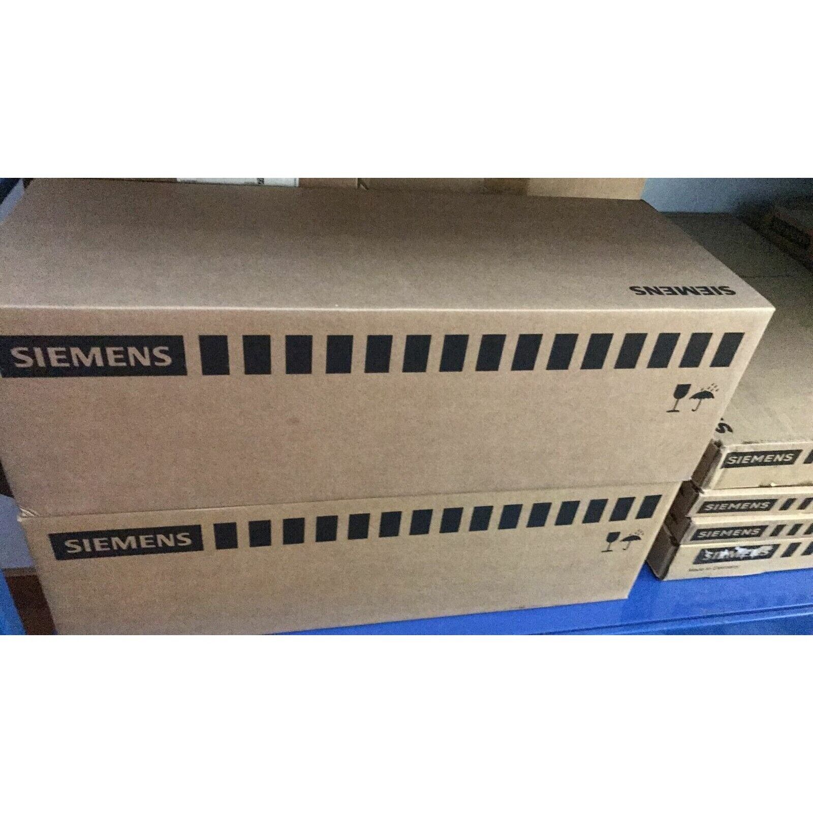 Siemens industrial automation parts packaging, PLC modules in brown boxes
