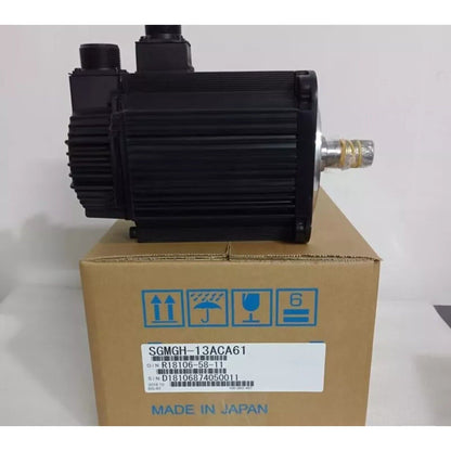 Yaskawa SGMGH-13ACA61 servo motor in box. Made in Japan. Includes model and serial number information.
