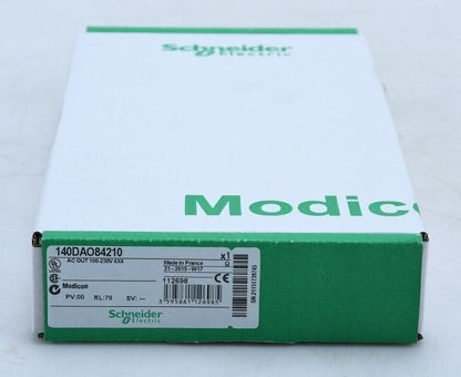 Schneider Electric Modicon Quantum 140DAO84210 PLC module box, green and white, featuring product details and brand logo.