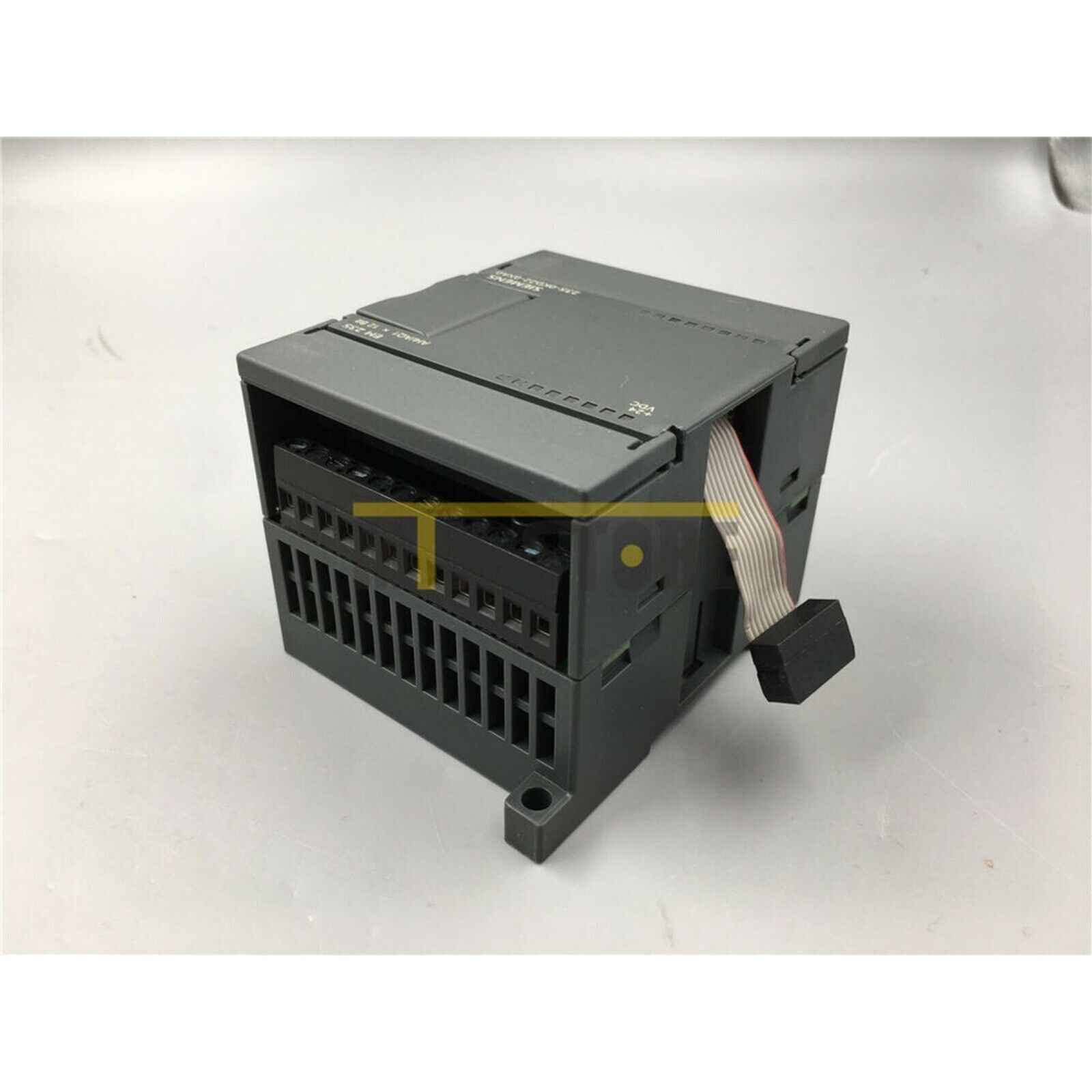 Siemens 6ES7235-0KD22-0XA0 PLC module, gray industrial automation equipment, with a ribbon cable, 24VDC marking.