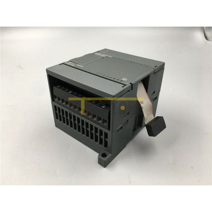 Siemens 6ES7235-0KD22-0XA0 PLC module, gray industrial automation equipment, with a ribbon cable, 24VDC marking.