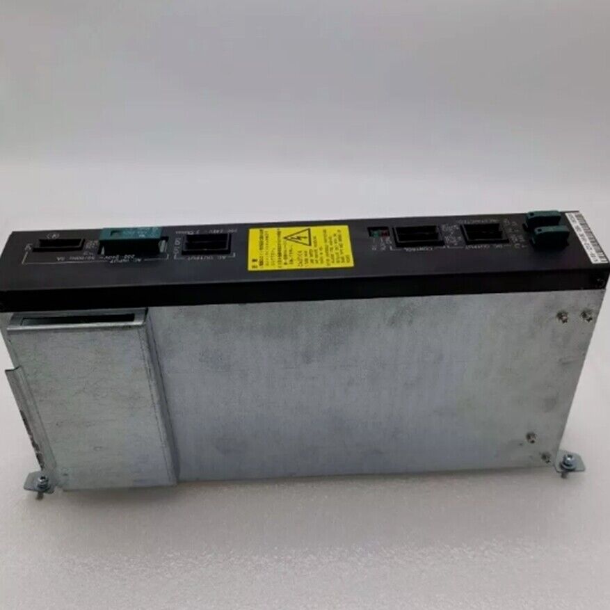 FANUC A16B-1212-0950 Power Supply. Industrial automation part with black top and silver case. Features safety warning label.