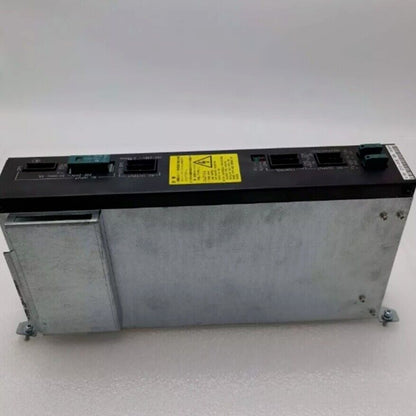 FANUC A16B-1212-0950 Power Supply. Industrial automation part with black top and silver case. Features safety warning label.