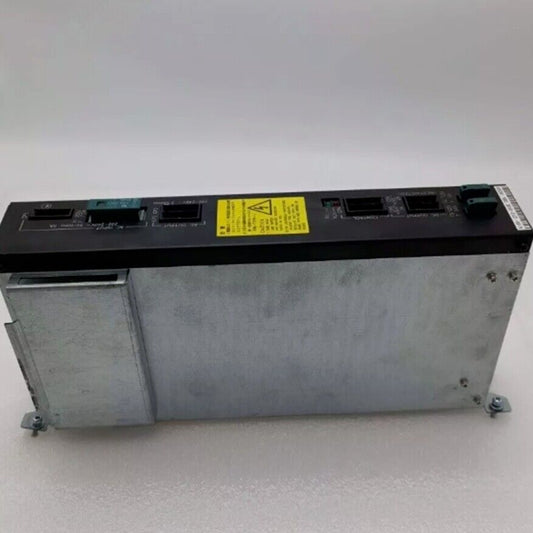 FANUC A16B-1212-0950 Power Supply. Industrial automation part with black top and silver case. Features safety warning label.