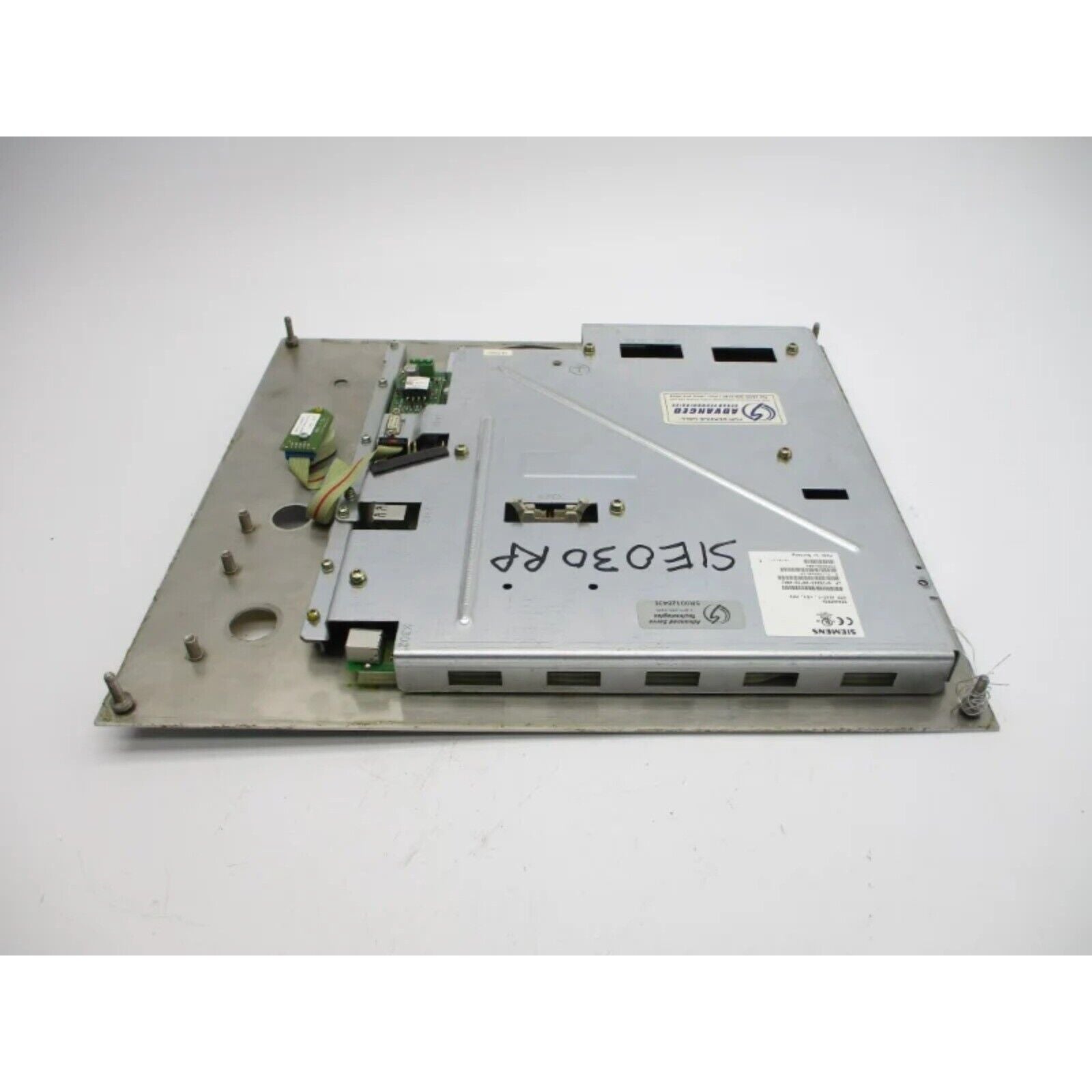 Siemens industrial control panel component, metallic with electronic parts. SIOE30RP marking, likely part of a PLC.