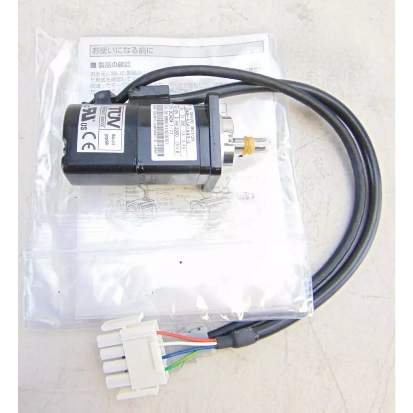 New Yaskawa SGMAH-A3A1A4S-E Servo Motor with cables and connectors for industrial automation.