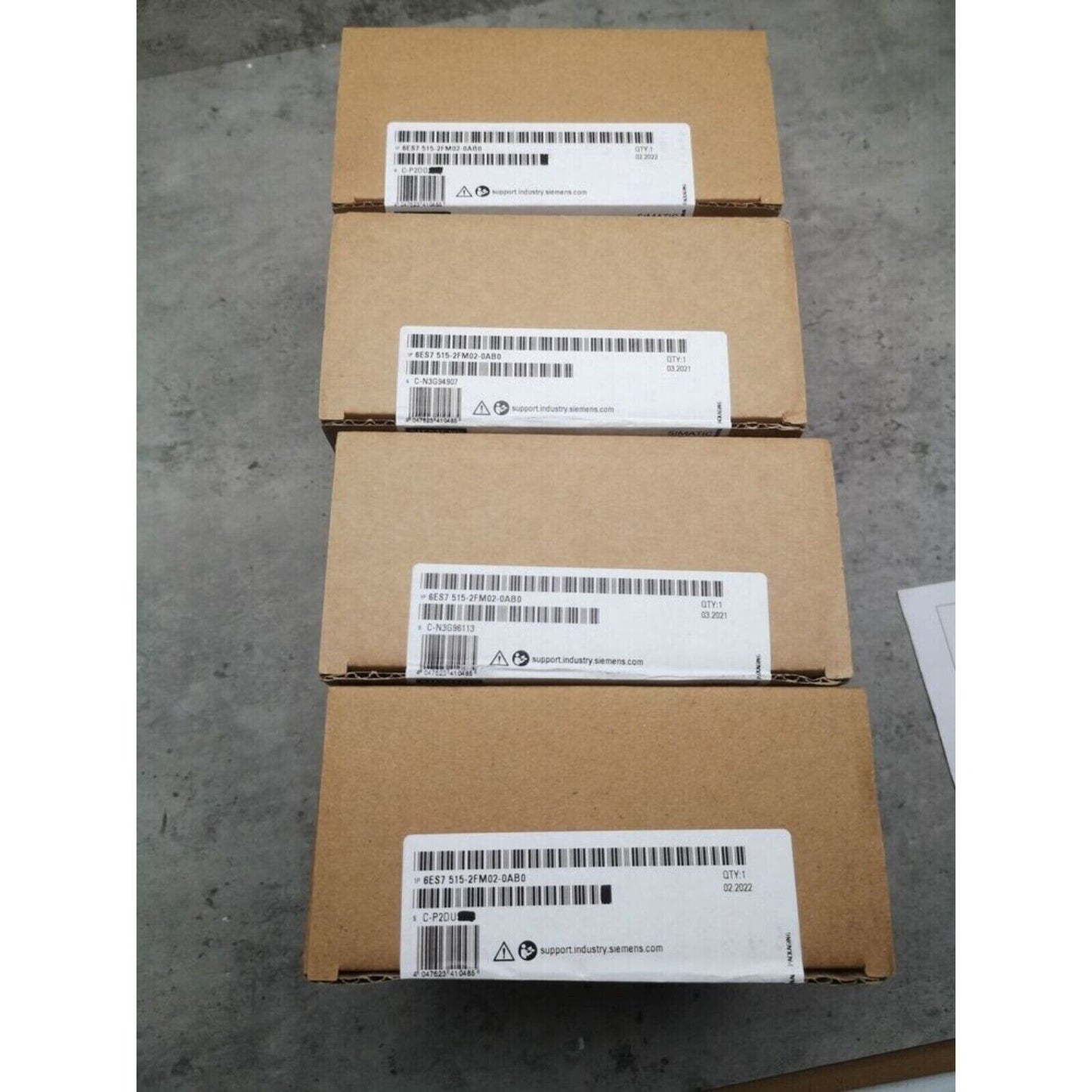 Siemens S7-1500 CPU 1515F-2 PN industrial automation parts, boxes with product details and labels.