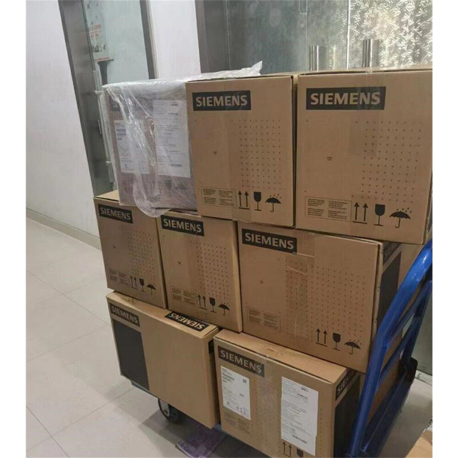 Stacked Siemens SINAMICS G120C Power Module boxes, industrial automation parts