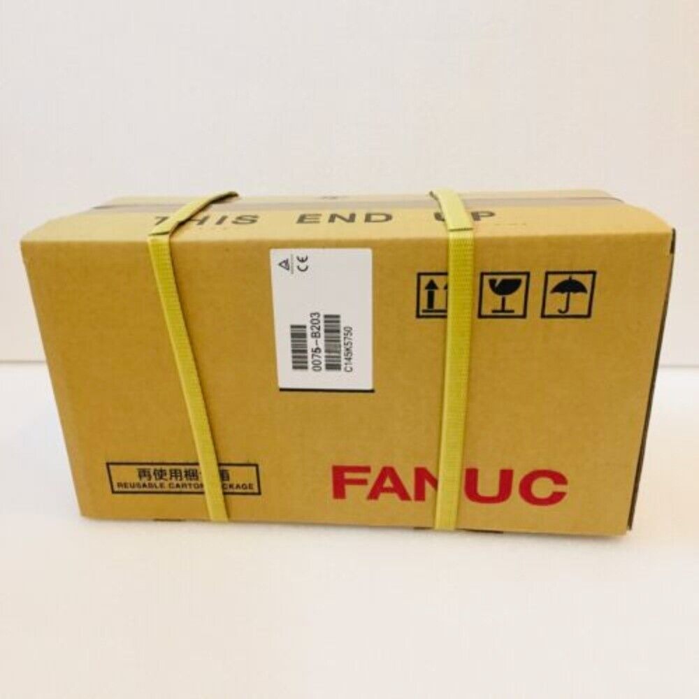 FANUC servo motor packaged in a cardboard box, labeled 'THIS END UP'. Reusable carton. Model A06B-0241-B400.