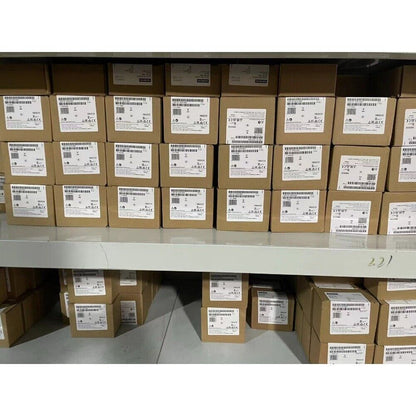 Mitsubishi A1SJ71UC24-R4 PLC Modules stacked in boxes, new stock available.
