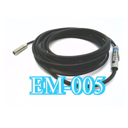 Keyence EM-005 Proximity Switch Sensor. Industrial automation part with black cable and metal sensor head. Fast shipping.
