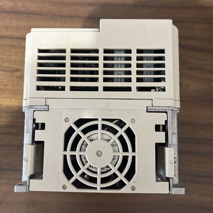 Yaskawa CIMR-JU4A0011BAA variable frequency drive, industrial automation part with fan. Input 380-480V, beige housing.