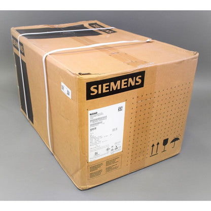Siemens SINAMICS G120 Power Module in a cardboard box, ready for shipping, with clear markings.