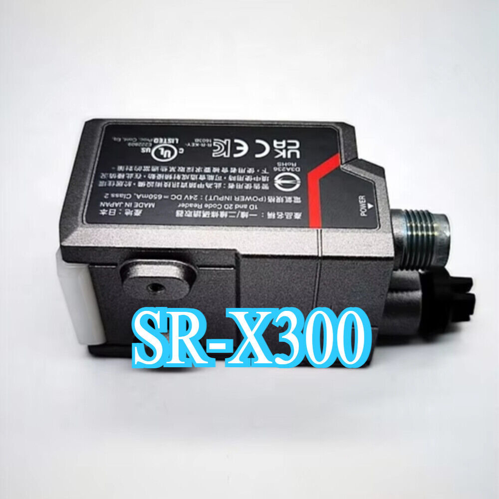 Keyence SR-X300 barcode reader. Industrial automation sensor with power connector and text.