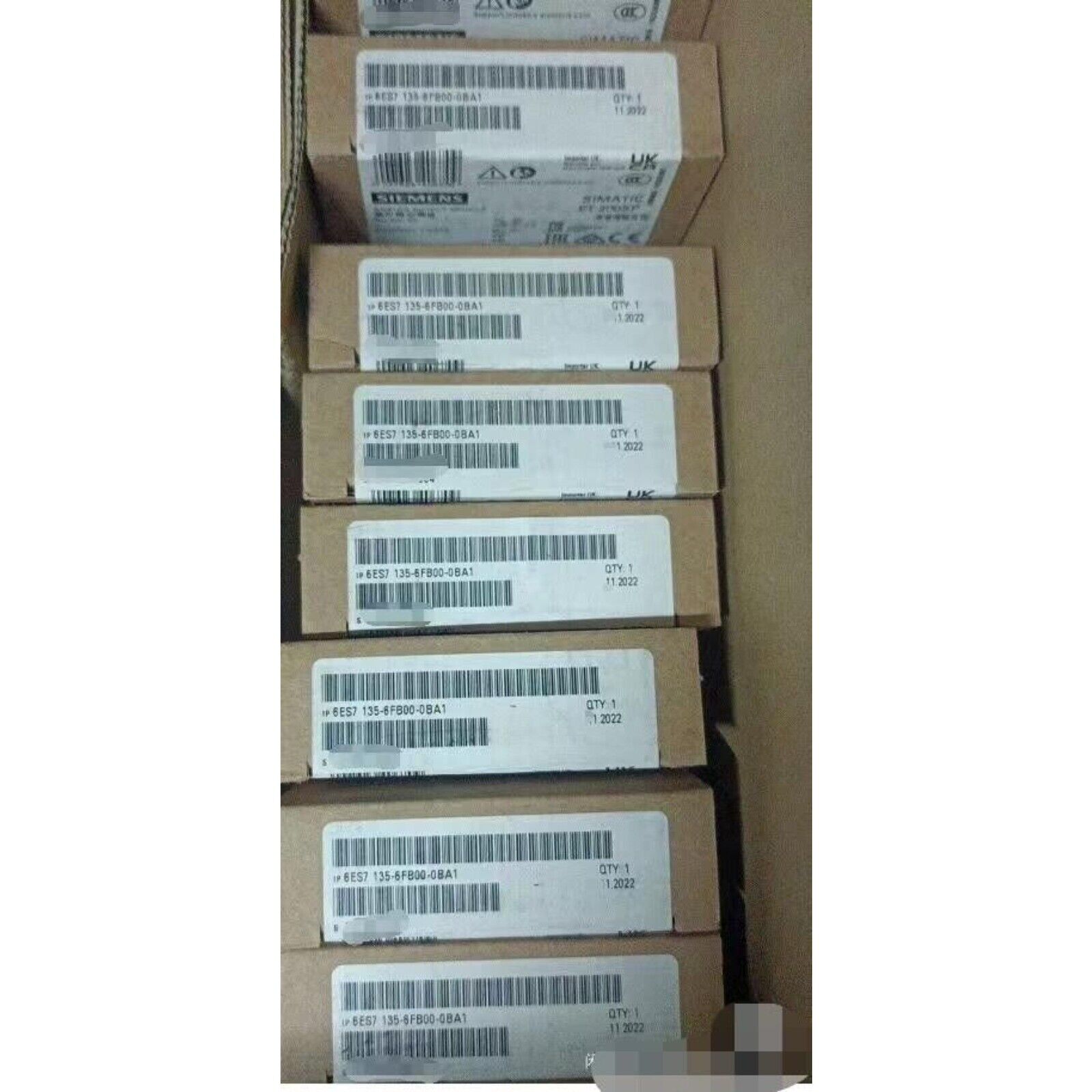 Siemens ET 200SP Analog Output Modules in boxes. Model 6ES7135-6FB00-0BA1, industrial automation parts.