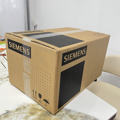 Siemens industrial automation part box on table, brown cardboard packaging