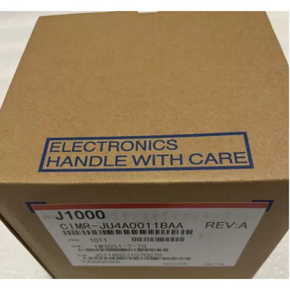 Yaskawa CIMR-JU4A0011BAA VFD box, J1000 series, cardboard packaging, 'Handle with Care' label, automation part.